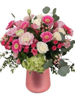 Blushing beauty-Delicate blush lisianthus, white roses, mini gerbera daisies, spray roses, hydrangea and more are combined and presented in a pink ceramic vase.-Spring Arrangements