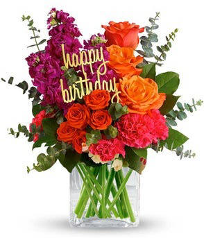 A clear vase filled with a variety of fresh colorful flowers with a happy birthday stake delivered the same day for 54.99
