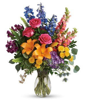 A georgeous display of the most beautiful varietyy of flowers every including orangelilies, pink flowers, snapdragons, greenerey and more $104.99