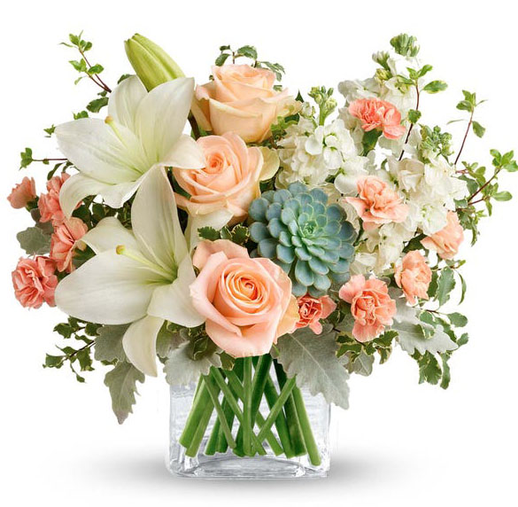 Southern Peach Bouquet with peach roses, white lilies, peach carnations, white stock and succulent in a glass cube vase