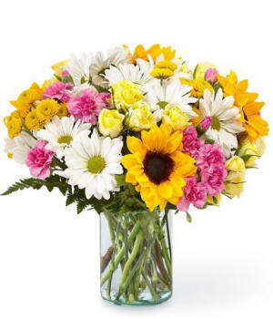 Yellow sunflowers and white daisies in a vase