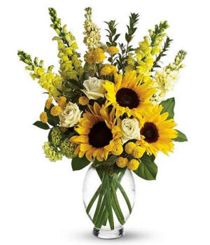 Tall vase arrangement with sunflowers and yellow snapdragons