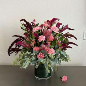 A flower bouqut with tropical flowers