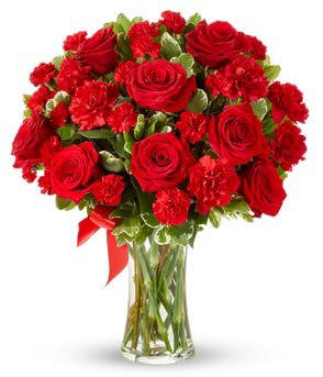 Red roses and carnations in a clear vase $64.99